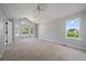 Spacious carpeted bedroom with two windows offering exterior views and natural light at 11506 Greenbriar Ln, Parker, CO 80138