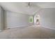 Bright room with vaulted ceiling, neutral carpet, and views to a sunlit kitchen at 11506 Greenbriar Ln, Parker, CO 80138