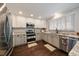 Modern kitchen featuring stainless steel appliances, granite countertops, and under cabinet lighting at 11506 Greenbriar Ln, Parker, CO 80138