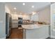 Well-lit kitchen features stainless steel appliances, granite countertops, and white cabinetry at 11506 Greenbriar Ln, Parker, CO 80138