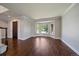Spacious living room with hardwood floors, bay window and a dark wooden front door at 11506 Greenbriar Ln, Parker, CO 80138
