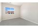 Bright bedroom with neutral walls and carpet, and a window with natural light at 875 E 78Th Ave # 69, Denver, CO 80229