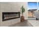 Modern linear fireplace with tile surround and built-in shelving at 875 E 78Th Ave # 69, Denver, CO 80229