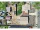 An aerial view of a home showing it's backyard, shed, driveway, and proximity to the street at 4835 Harlan St, Wheat Ridge, CO 80033