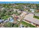 An aerial shot showcases the home and surrounding neighborhood with mature trees and well-maintained streets at 4835 Harlan St, Wheat Ridge, CO 80033