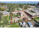 Aerial view showcases the property's layout, including the home, detached garage, and fenced yard at 4835 Harlan St, Wheat Ridge, CO 80033