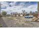 Open backyard featuring various storage structures at 4835 Harlan St, Wheat Ridge, CO 80033