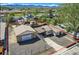 Exterior view of a house and garage, showing the yard, fence and neighborhood setting at 4835 Harlan St, Wheat Ridge, CO 80033