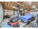 Spacious garage with high ceilings and a car lift at 4835 Harlan St, Wheat Ridge, CO 80033