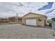 A detached garage with a clean white door and ample parking space, enhancing property value at 4835 Harlan St, Wheat Ridge, CO 80033