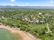An aerial view showing a neighborhood with a lake nearby and the property location marked by a pin with community amenities at 2019 Clipper Dr, Lafayette, CO 80026