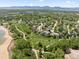 Property aerial view highlighting the neighborhood and mountain views, showcasing its ideal location near green spaces at 2019 Clipper Dr, Lafayette, CO 80026