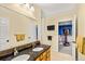 Elegant bathroom with double sinks, granite countertop, and stylish tile accents at 2019 Clipper Dr, Lafayette, CO 80026
