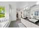 Bright bathroom features double sinks, a granite countertop, large soaking tub, and walk-in closet at 2019 Clipper Dr, Lafayette, CO 80026