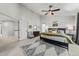 Bright bedroom features a ceiling fan, a decorative rug, and neutral tones creating a serene atmosphere at 2019 Clipper Dr, Lafayette, CO 80026