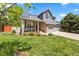 Charming two-story home with a stone facade, well-manicured lawn, and a spacious two-car garage at 2019 Clipper Dr, Lafayette, CO 80026
