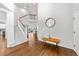 Grand entryway features hardwood floors, staircase, and stylish decor that creates a welcoming atmosphere with bright, natural light at 2019 Clipper Dr, Lafayette, CO 80026