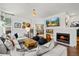Comfortable living room featuring a cozy fireplace, stylish decor, and ample seating for relaxation at 2019 Clipper Dr, Lafayette, CO 80026