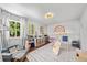 Well-lit playroom with playful decor, loft, slide, and a designated reading area providing a stimulating environment at 2019 Clipper Dr, Lafayette, CO 80026
