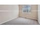 Neutral bedroom with carpet, a window, and neutral walls at 22436 E Maplewood Pl, Aurora, CO 80015