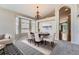Elegant dining room with chandelier, bay window, and neutral decor at 22436 E Maplewood Pl, Aurora, CO 80015