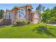 Well-maintained lawn and landscaping complement this charming two-story home's exterior at 22436 E Maplewood Pl, Aurora, CO 80015