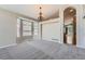 Bright living area features large windows, neutral paint, and an open layout at 22436 E Maplewood Pl, Aurora, CO 80015