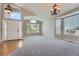 Inviting living room featuring high ceilings, ample windows, and a neutral color scheme at 22436 E Maplewood Pl, Aurora, CO 80015