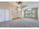 Bright living room featuring soaring ceilings, large windows, and a neutral color palette at 22436 E Maplewood Pl, Aurora, CO 80015