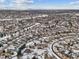 Aerial view of a residential neighborhood in winter at 5885 Cheetah Cv, Lone Tree, CO 80124