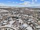 Aerial view of a snow-covered residential neighborhood at 5885 Cheetah Cv, Lone Tree, CO 80124