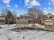 Two-story house on a tree-lined street with a large driveway at 5885 Cheetah Cv, Lone Tree, CO 80124