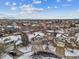 Aerial view of a residential neighborhood with houses covered in snow at 5885 Cheetah Cv, Lone Tree, CO 80124