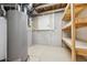 Unfinished basement area with water heater and shelving at 5885 Cheetah Cv, Lone Tree, CO 80124