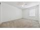 Simple bedroom with window, ceiling fan and carpet at 5885 Cheetah Cv, Lone Tree, CO 80124