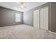 Well-lit bedroom with closet and gray walls at 5885 Cheetah Cv, Lone Tree, CO 80124