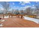 Back deck with built-in bench and snowy view at 5885 Cheetah Cv, Lone Tree, CO 80124