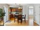 Kitchen with breakfast bar, and adjacent dining area at 5885 Cheetah Cv, Lone Tree, CO 80124