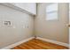 Laundry room with white cabinets and hardwood floors at 5885 Cheetah Cv, Lone Tree, CO 80124