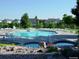 Community pool with a hot tub and plenty of lounge chairs at 5885 Cheetah Cv, Lone Tree, CO 80124