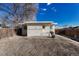 Backyard view of property with detached garage at 2031 Meade St, Denver, CO 80211