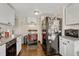 Functional kitchen with ample cabinetry and modern appliances at 2031 Meade St, Denver, CO 80211