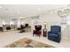 Finished basement featuring sitting area, track lighting and large windows for natural light at 742 Megan Ct, Longmont, CO 80504