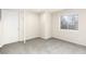 Unfinished basement room with a window and door perfect for storage or customization at 742 Megan Ct, Longmont, CO 80504