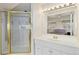 Bright bathroom featuring a glass shower enclosure, vanity and elegant fixtures at 742 Megan Ct, Longmont, CO 80504