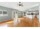 Spacious living area with hardwood floors and access to the kitchen and a sliding door to the outdoor area at 742 Megan Ct, Longmont, CO 80504