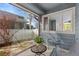 Relaxing screened patio with seating and views of the surrounding neighborhood, perfect for enjoying the outdoors at 742 Megan Ct, Longmont, CO 80504