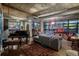 Spacious living room with large windows, a piano, and an open, industrial-style ceiling at 2100 16Th St # 412, Denver, CO 80202