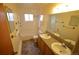 Bright bathroom with double sinks and a full tub and shower, offers plenty of space at 8450 Mason Cir, Westminster, CO 80031