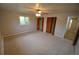 Spacious main bedroom features soft carpeting, and generous natural light from large window at 8450 Mason Cir, Westminster, CO 80031